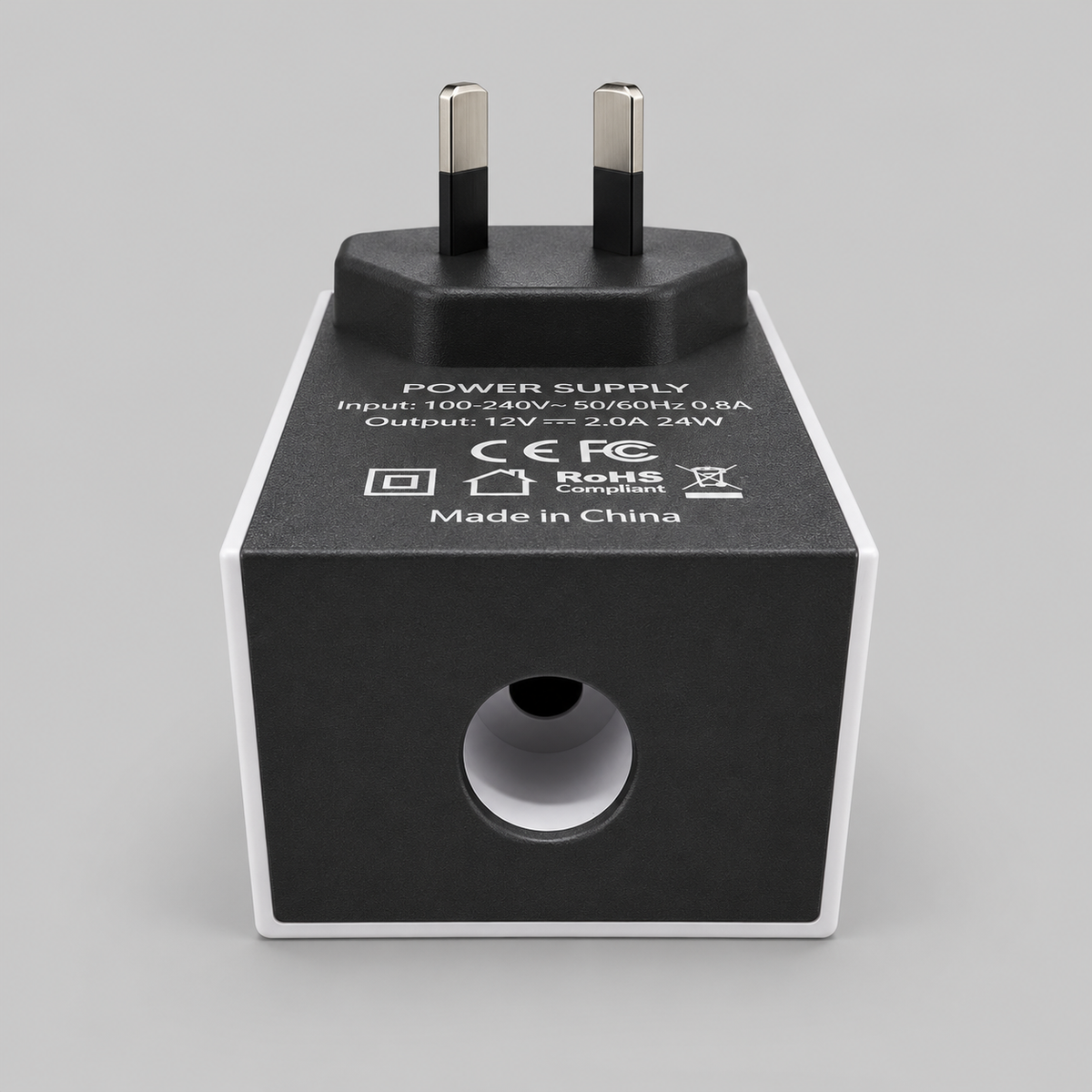 Front view of the Starlink Mini AC/DC power supply showing the circular opening, black adapter body and Australian plug