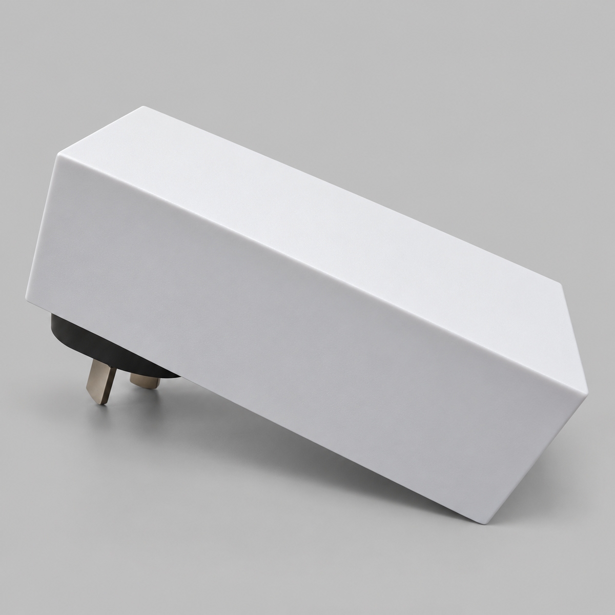 Starlink Mini AC/DC power supply showing its white rectangular housing and Australian power plug from an angled side view