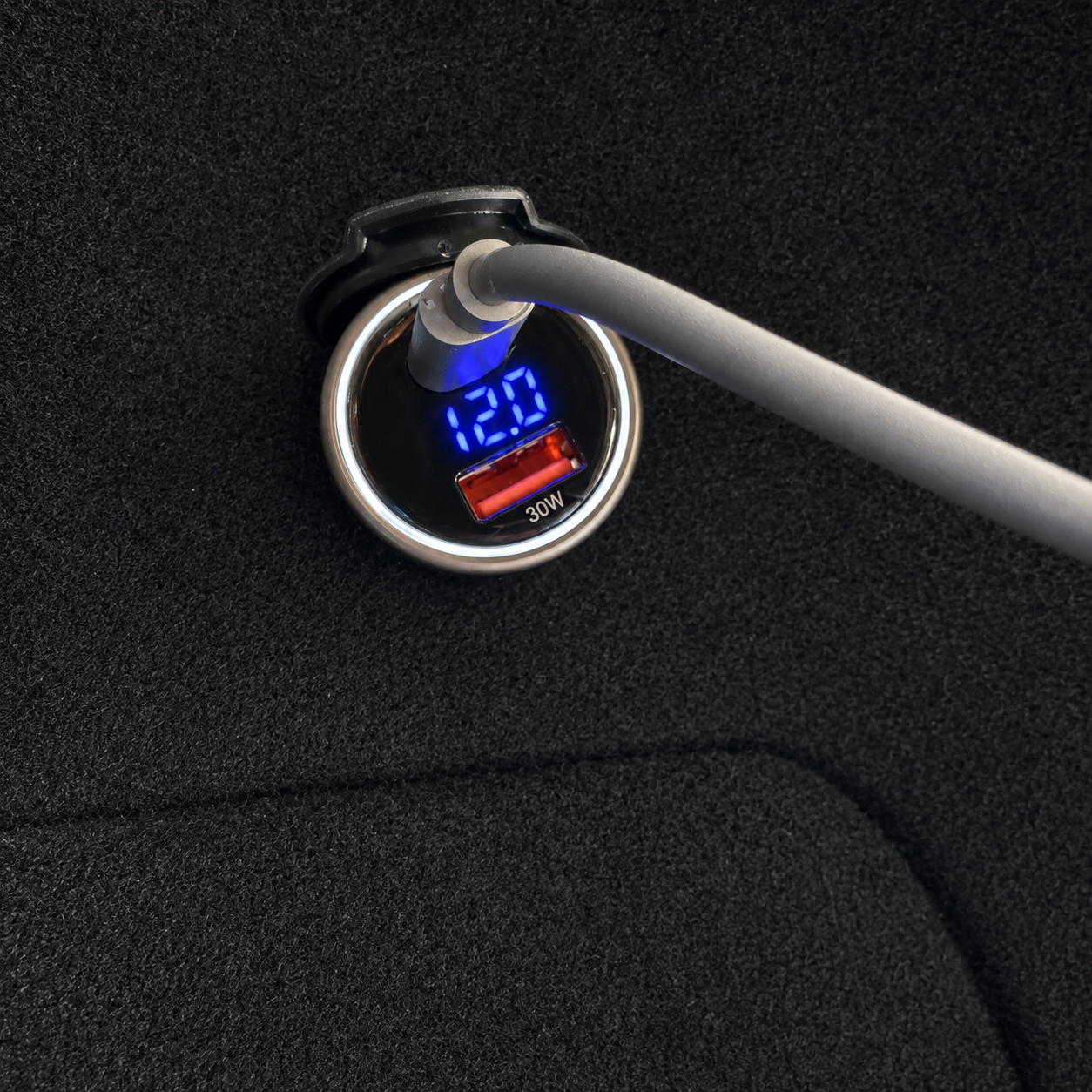 100W PD 12V car power adaptor for Starlink devices installed in a vehicle, showing USB-C Power Delivery charging with integrated digital voltage display and charging cable connected.